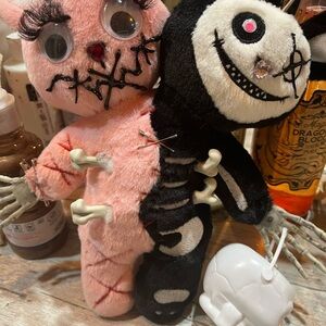 Pink and Black Plush Skeleton Dolls